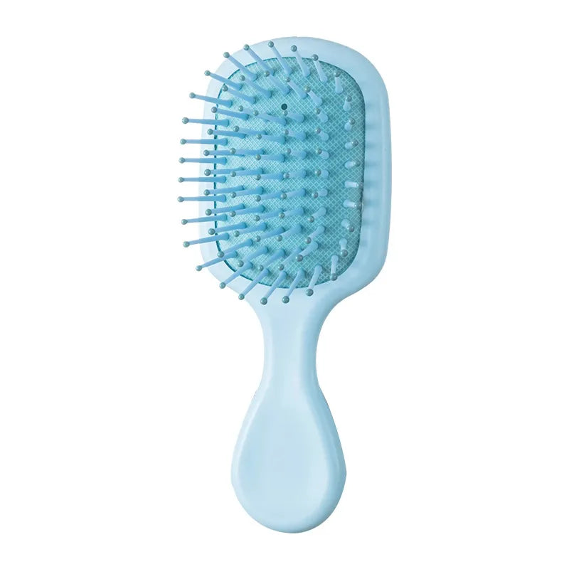 "Portable" small hairbrush blue